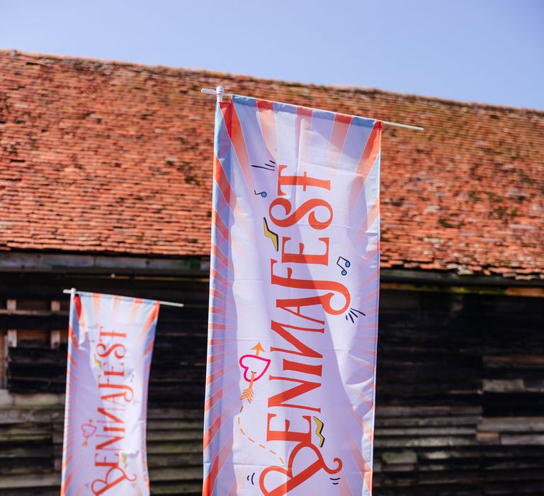 Colourful festival style wedding welcome banners for barn wedding in Essex