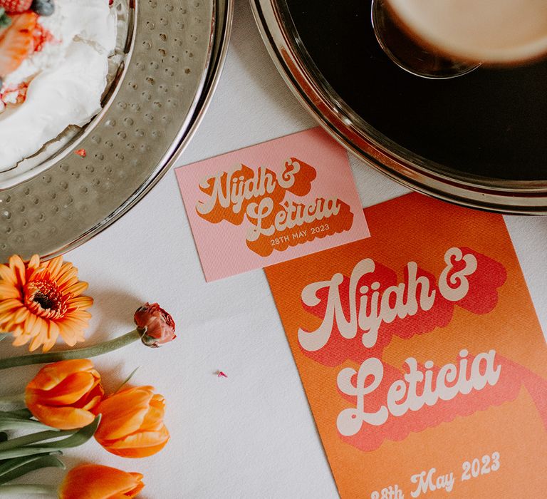 Retro wedding invitations with bold font and vibrant orange, yellow and pink colour scheme 