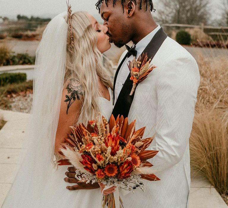 Orange dried flower bouquet for bride and gold wedding crown