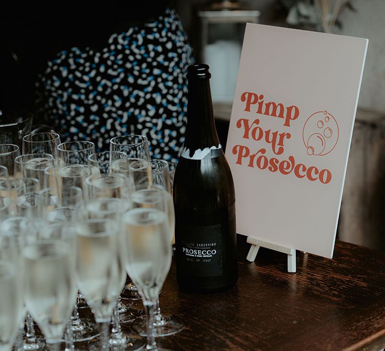 Pimp your Prosecco station for the wedding drinks with a pale pink and orange sign 