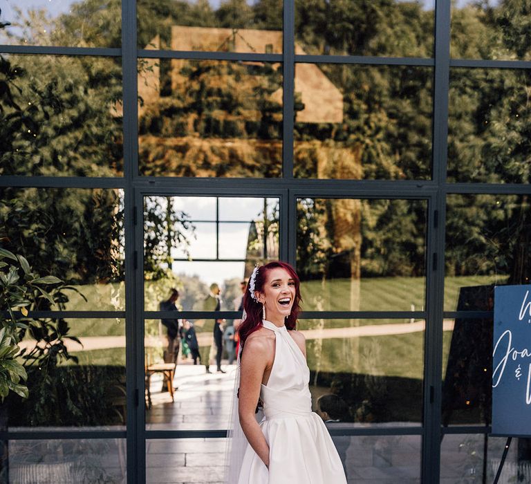 Bride in Halfpenny London wedding dress with overskirt and black wedding shoes by Manolo Blahnnik 