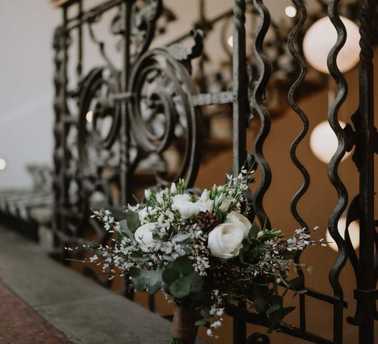 white garden rose, eucalyptus, baby's-breath and foliage bridal bouquet in La Cabane Des Praz wedding venue