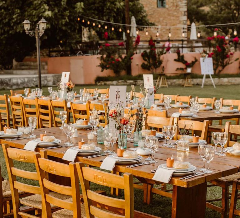 greece destination wedding with wooden tables and chairs and plant pot favours