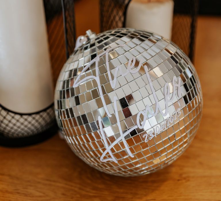 Large disco ball with personalised new last name of the bride and groom 