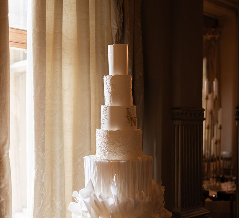 Luxury all-white seven tier wedding cake for classic country house wedding 