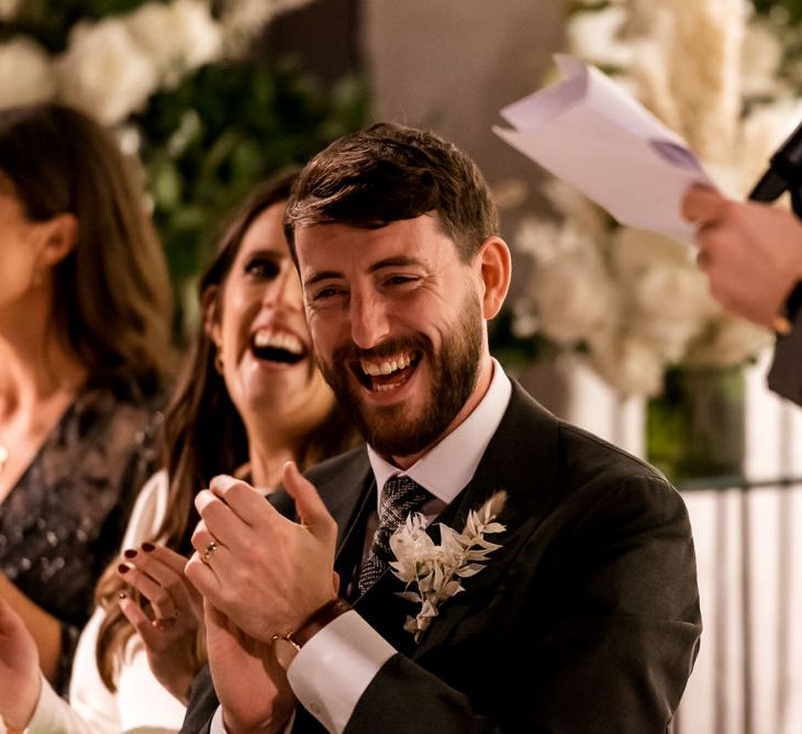 Groom enjoys wedding speeches