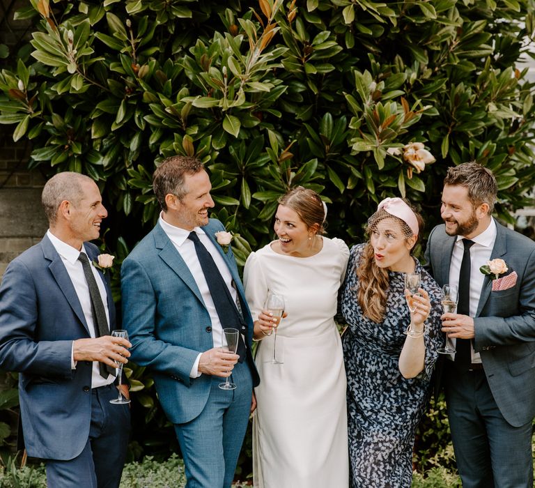 Bride and groom with wedding guests at micro wedding at Pylewell Park