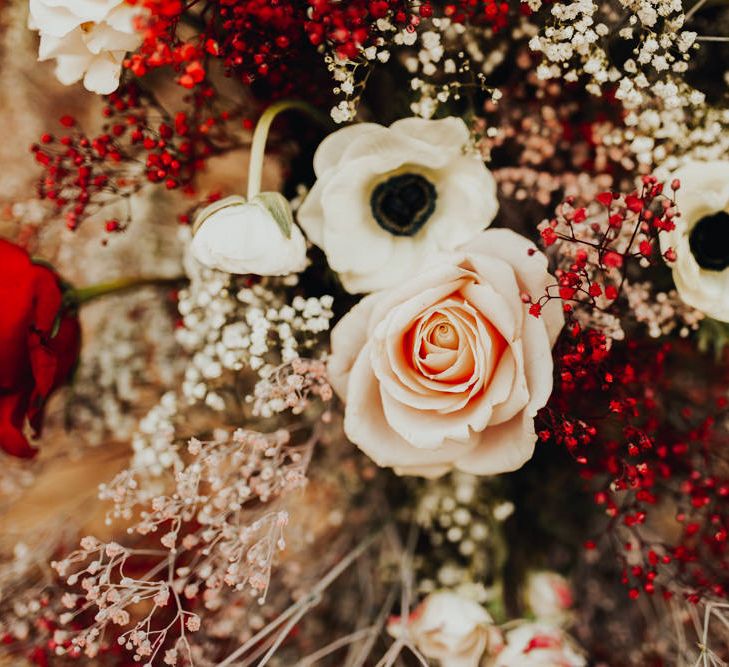 Wedding day florals including a red spray-painted gypsophila 