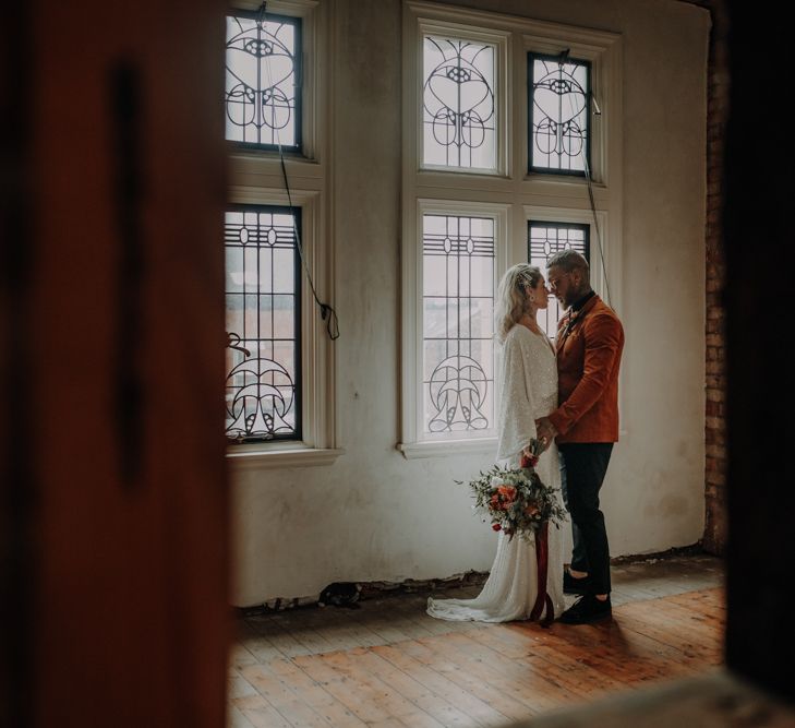 Couple portrait by stained glass windows