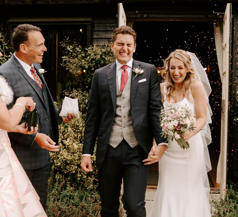 Confetti moment at intimate Clock Barn wedding