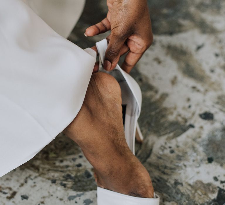 Sleek minimal peep toe bridal heels for all white wedding