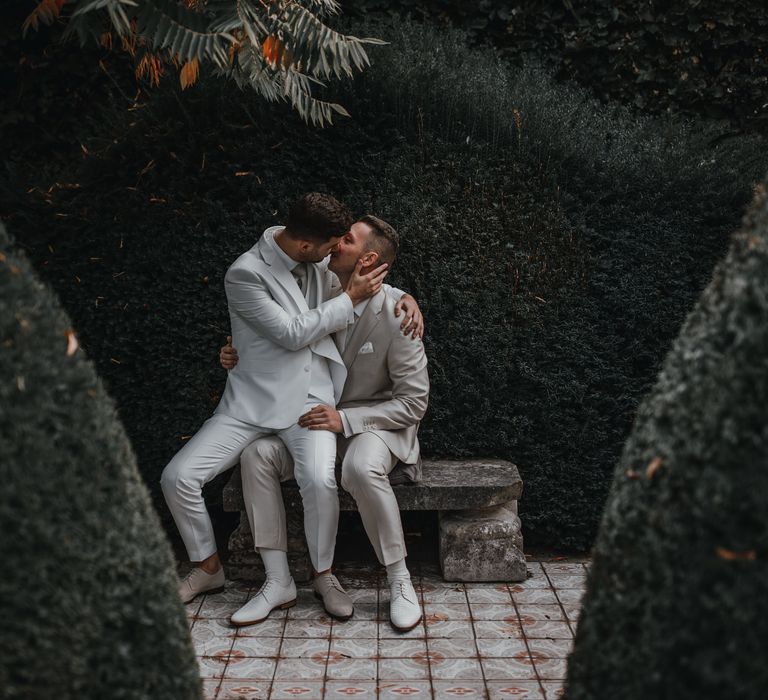 Grooms kiss at gay wedding