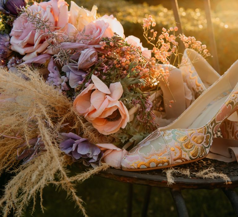 Golden hour image with pastel florals and colourful heels