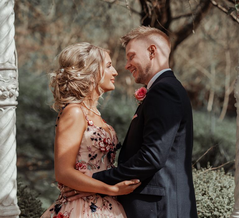 Bride & groom look lovingly at one another on their wedding day