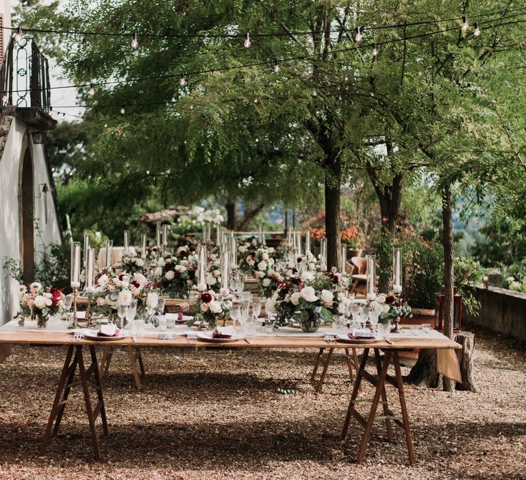 Wooden rustic Italian table settings for outdoor reception