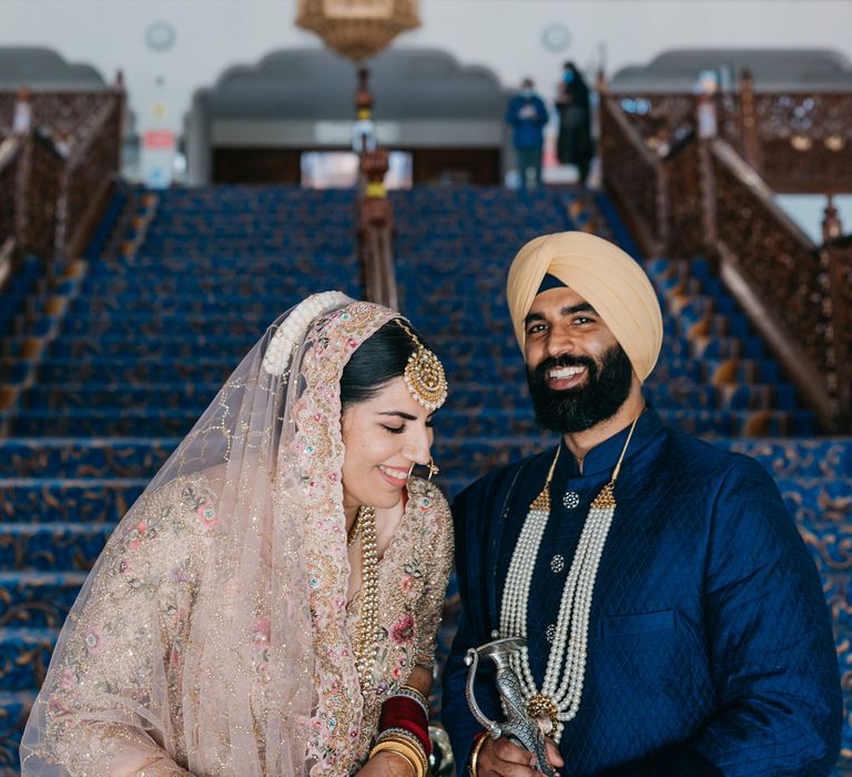 Bride & groom look lovingly at one another on their wedding day