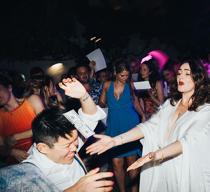 Brides dance outside for wedding reception in Menorca