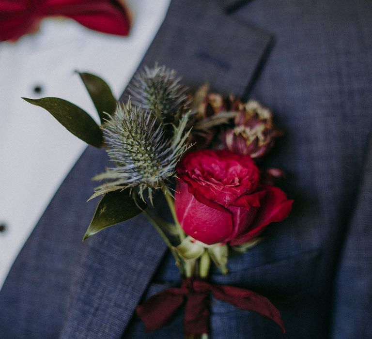 Red rose and thistle buttonhole flower