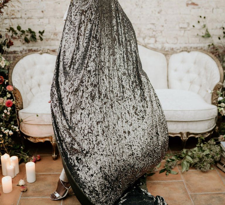 Bride with alopecia in a long black sequin bridal cape 