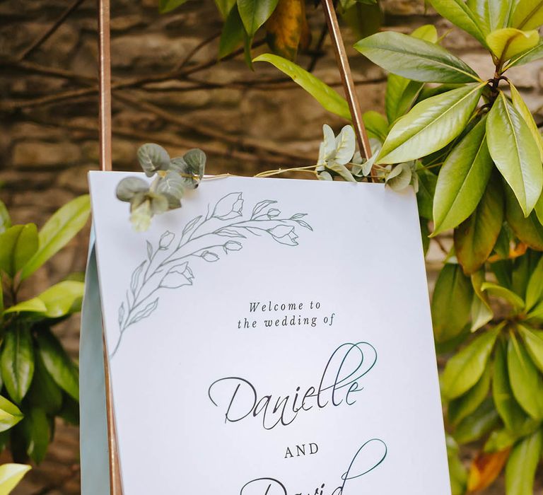 White personalised stationery complete with green foliage