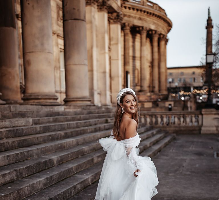 Romantic Daniel Chu wedding dress with tulle fabric, bow design and strapless neckline