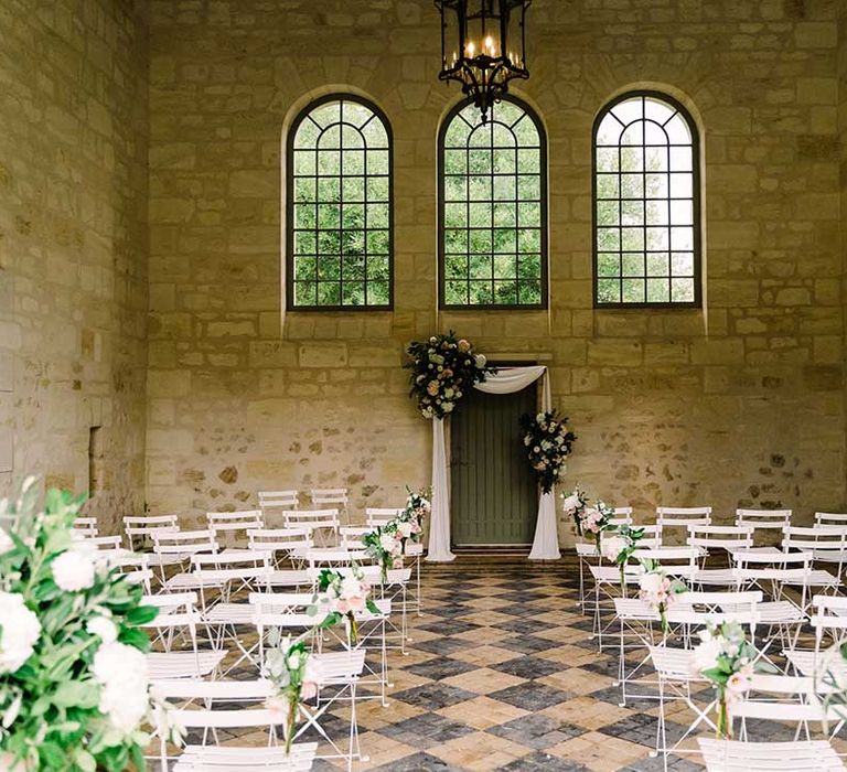 Rustic wedding venue for ceremony complete with wicker chairs 