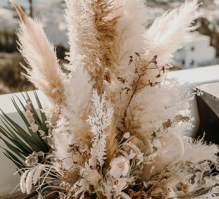 Fully pampas grass decor with dried florals outdoors 