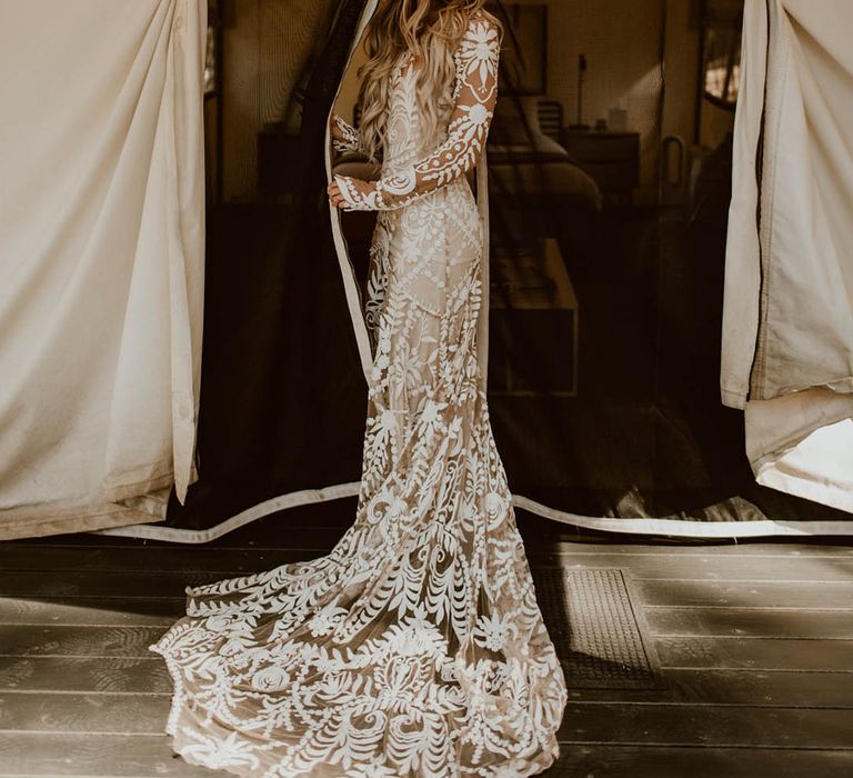 Bride wears boho chic styled wedding gown on her wedding day