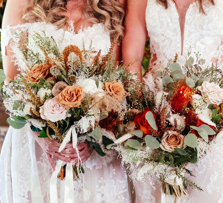 Warm toned autumnal wedding flower bouquets with roses and astilbe 