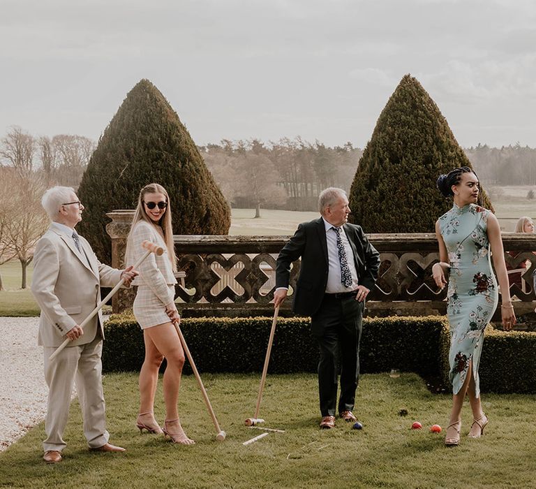 Wedding guests play games outside 