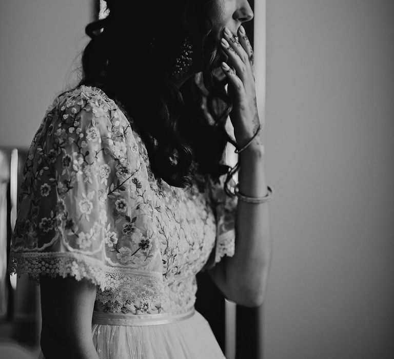 Bridesmaid sees bride for the first time during first look moment in black and white image