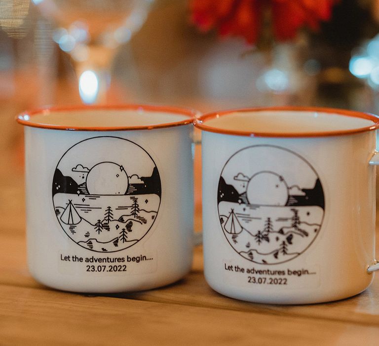 Camping cups personalised for the couple given out as wedding favours 