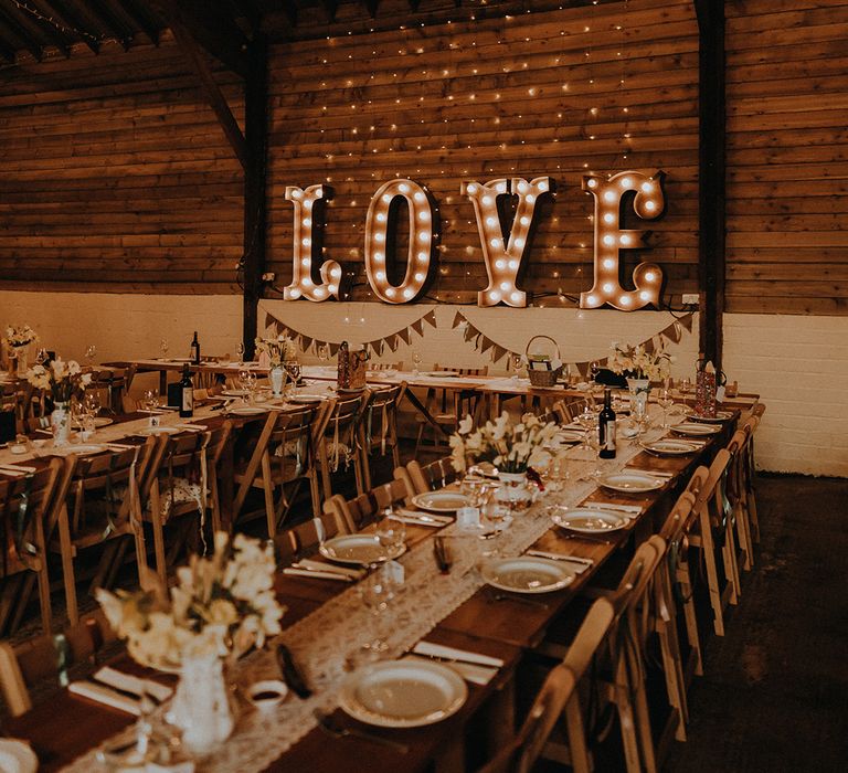 Rustic romance wedding them at Exmouth Country Lodge wedding venue with LOVE letter lights 