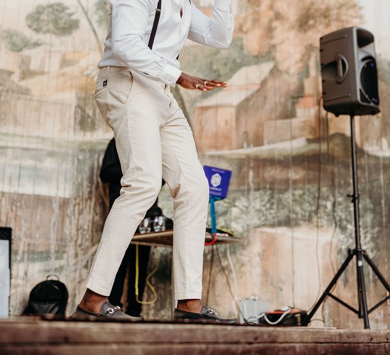 A live singer performs on stage at the outdoor wedding celebrations 