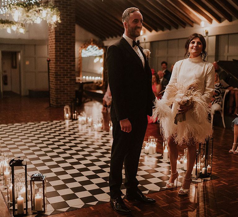 Cosy lantern aisle decorations at traditional but modern wedding day 