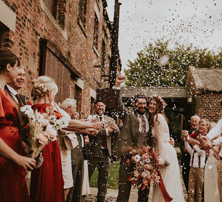 Autumnal October wedding with outdoor confetti exit at industrial wedding venue in Yorkshire 