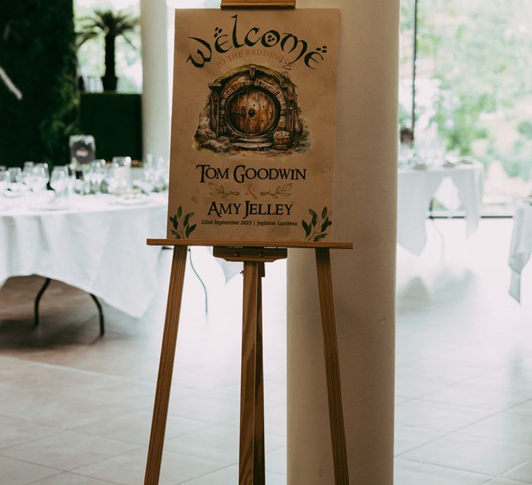 Lord of The Rings wedding welcome sign idea with painted hobbit door 