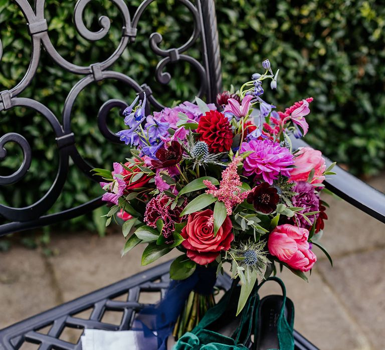 Bright wedding bouquet with roses and dahlias for autumn wedding with green velvet wedding shoes 