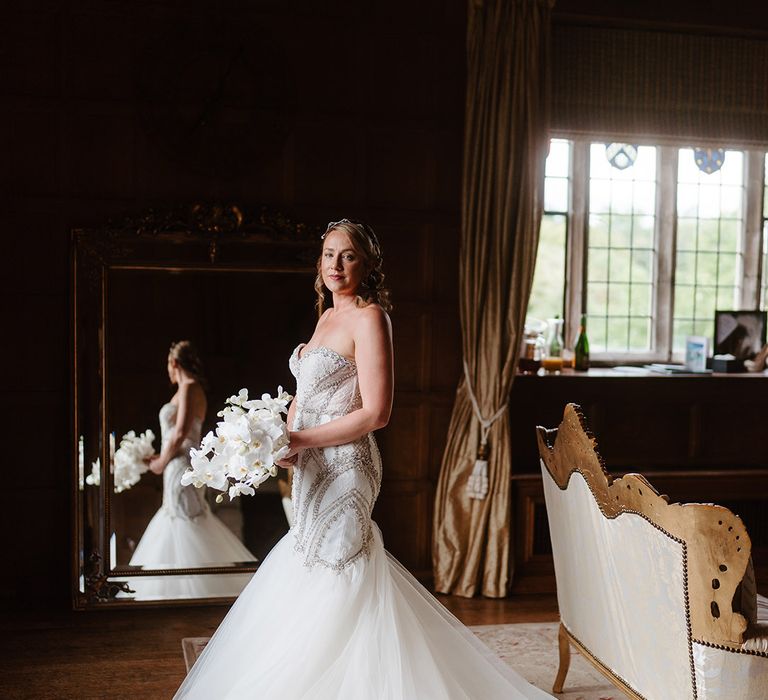 Bride in sweetheart strapless mermaid wedding dress with long train 