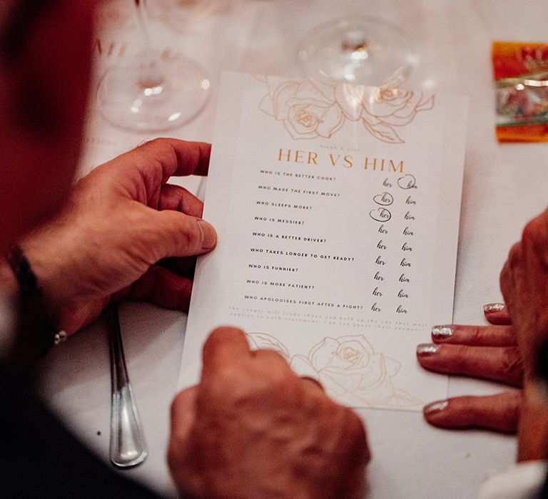 Wedding guests plays her vs. him wedding quiz games for entertainment at the wedding breakfast 