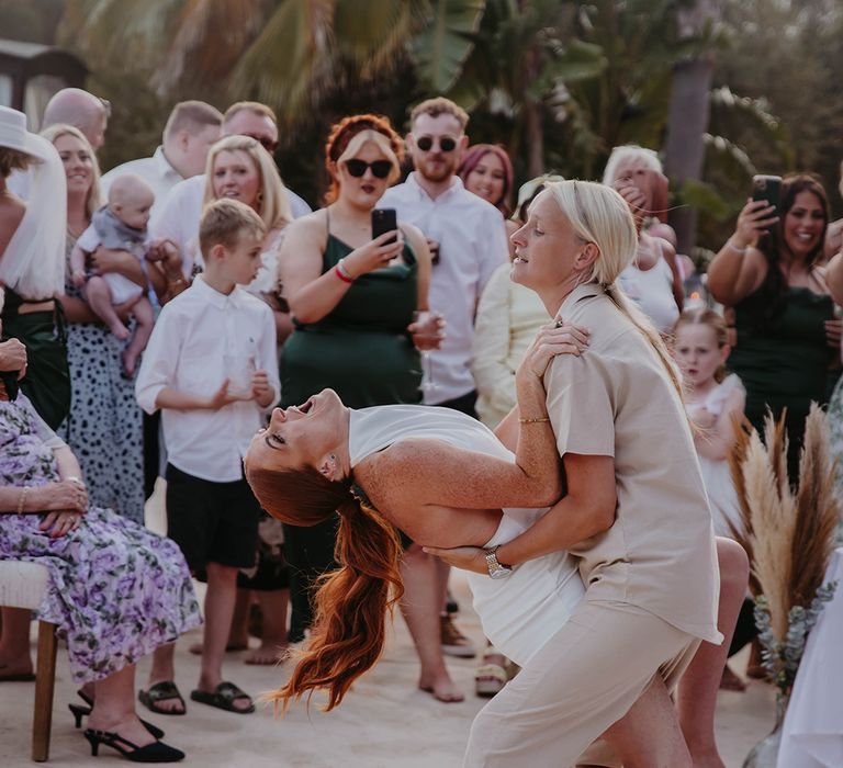 First dance for two brides at lesbian wedding at a villa in Ibiza with boho fashion and styling 