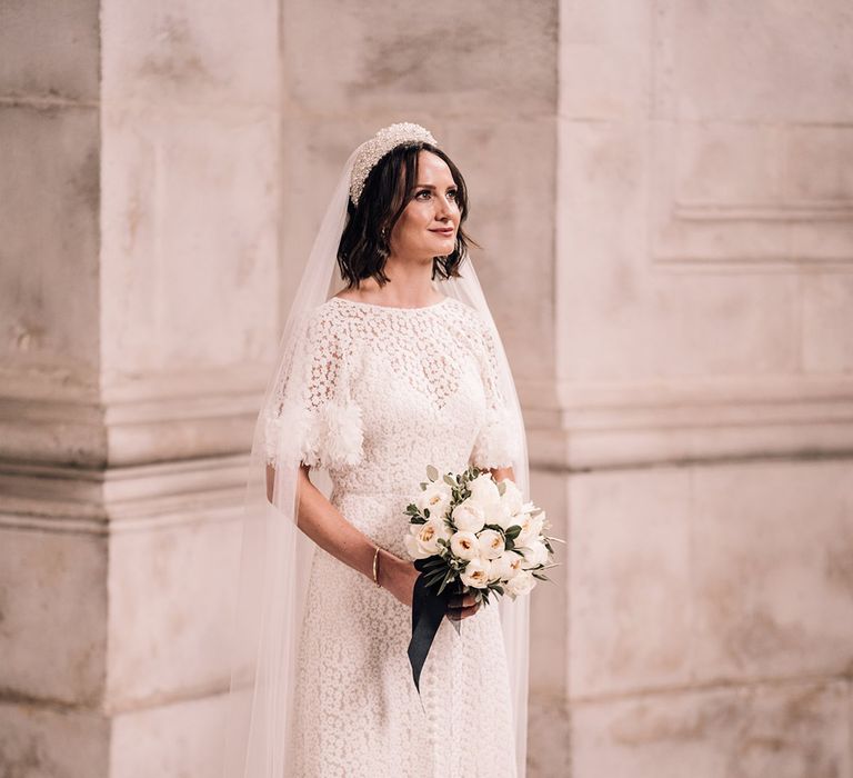 Bride in short petal sleeve flower bespoke wedding dress 