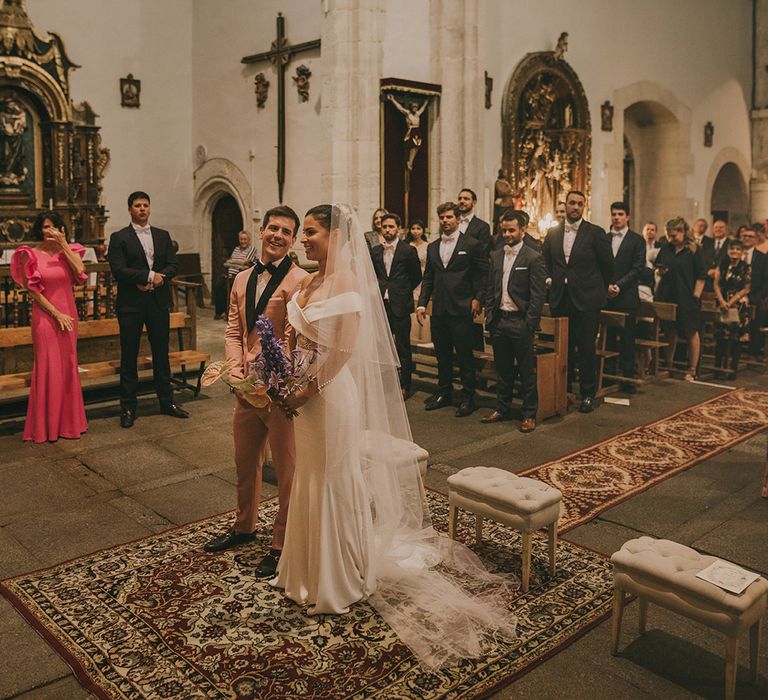 Bride and groom exchanging vows in the church