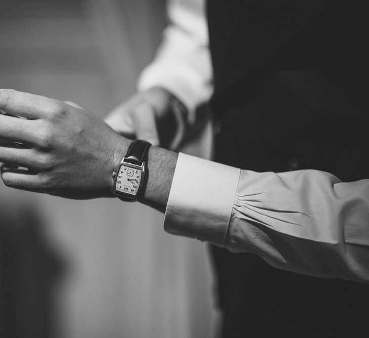 Groom fitting watch before he ties the knot 