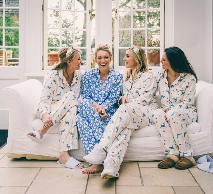 Bride and bridesmaids on the wedding morning in matching pyjamas 