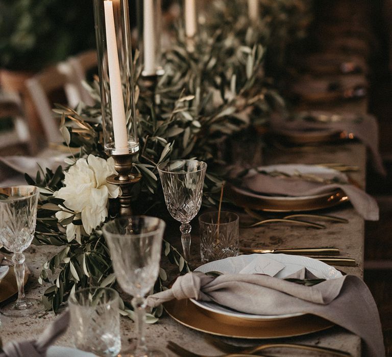 Candlesticks and olive branches bouquets table decorations