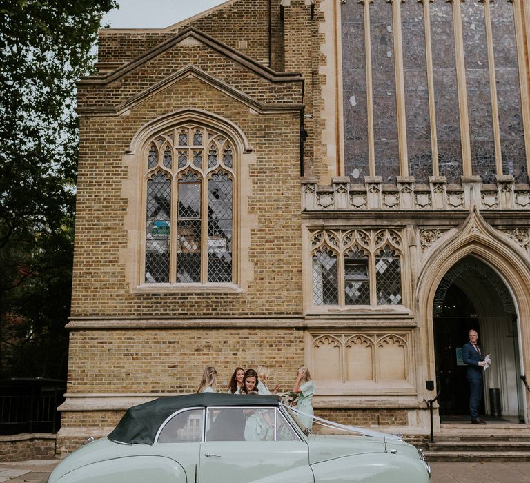 London church wedding with mint pastel green car and bridesmaid dresses