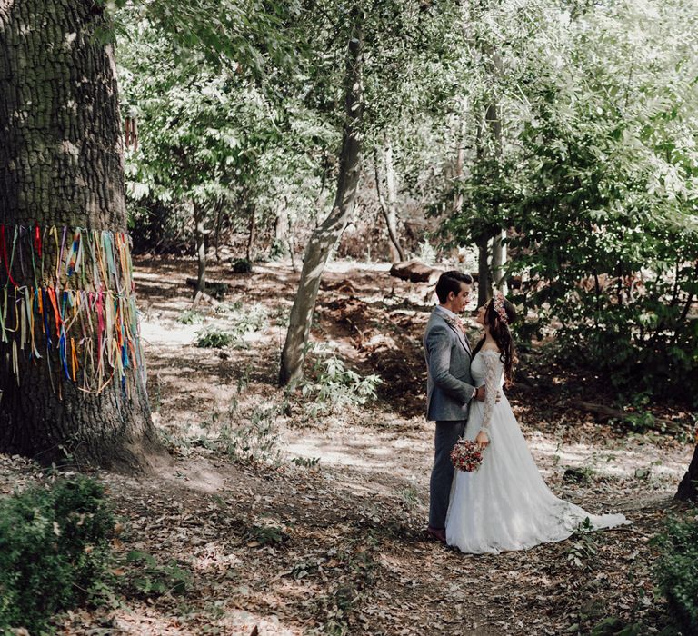 Bride and groom in forest shoot at outdoor wedding