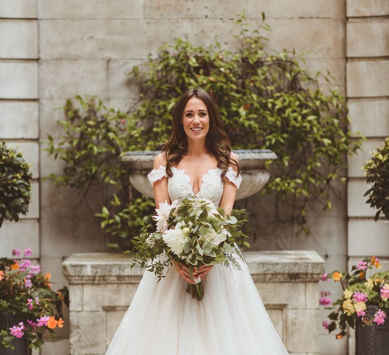 Tulle princess wedding dress with off the shoulder sleeves and lace details by Alexa Penberthy Photography