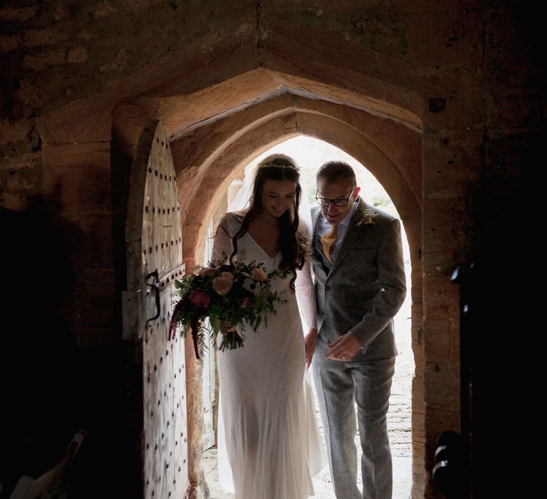 Bride to be walking into church with father of the bride 